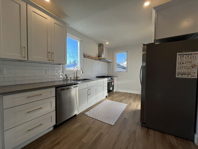 Photo - Updated Portland Home Featuring LVP Flooring, Modern Stainless Appliances, and Soaking Tub