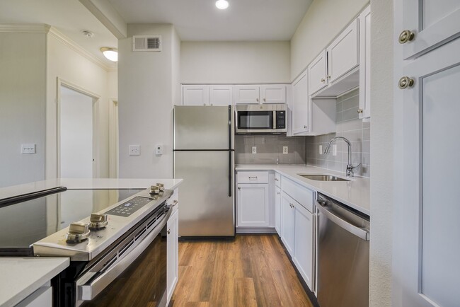 Expansive kitchen island with ample counter space - Windsor Mustang Park Apartments