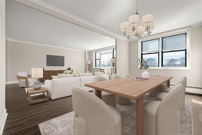 Elegant natural light-filled open-concept apartment living room with a modern dining area, featuring stylish lighting, large windows, and chic decor at Parkside Place, apartments in Cambridge, MA