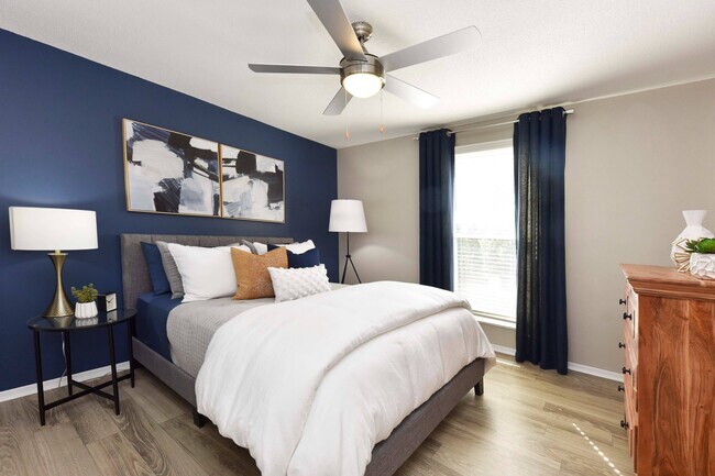 Bedroom with hardwood-style flooring