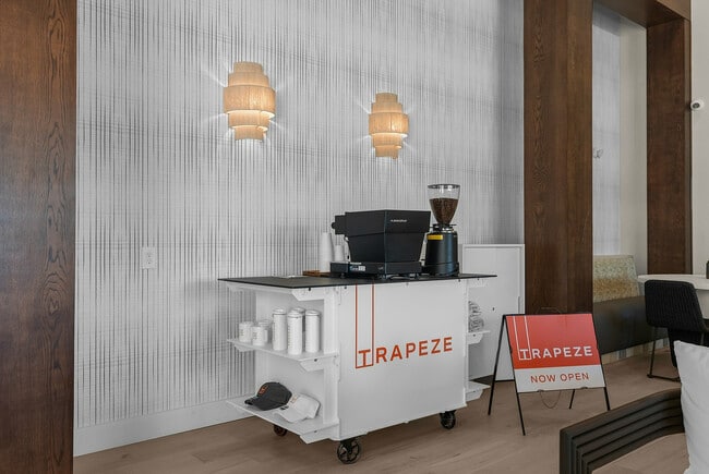 Experience cozy elegance at the Trapeze coffee corner, now open for your relaxation.