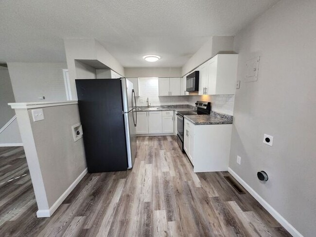 Photo - 2-Bedroom Townhome with Fenced Backyard and Modern Updates!