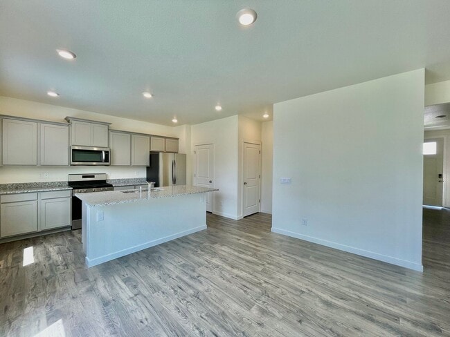 Photo - Spacious 4-Bedroom Wellington Home with 3-Car Garage, Loft & Fenced Backyard!