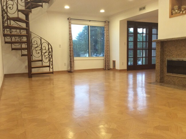 Living Room w/ Stairs to loft - 7505 Hampton Ave Unit 16