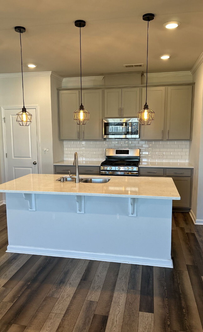 Photo - Modern townhome with high-end finishes throughout, minutes to 540 and walkable to great shopping.