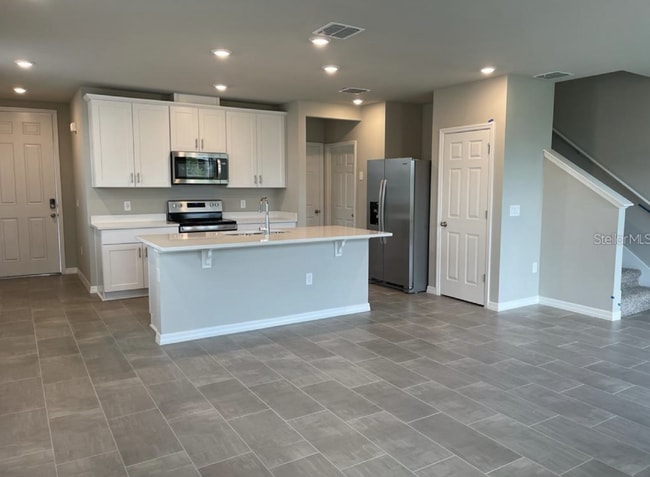 Photo - Beautiful corner unit townhouse features an abundance of natural
light.