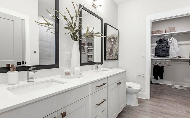 Luxurious bathroom with double vanity and spacious walk-in closet - Sinclair Cary