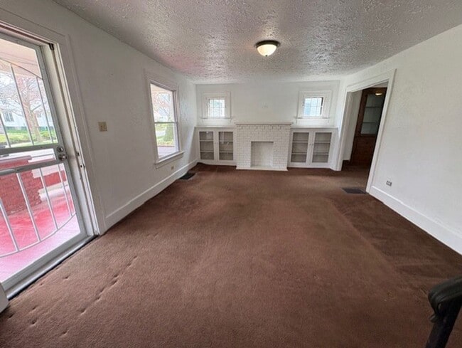 Photo - Spacious 4-Bedroom Akron Home with Charming Kitchen Nook & Backyard & Pet Friendly