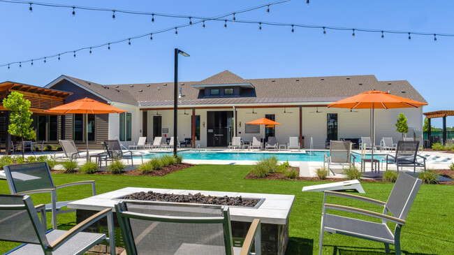 Resort-Style Pool & Outdoor Lounge Area - The Waters at West Village Apartments