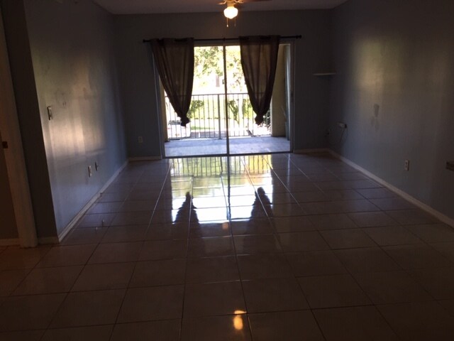 Living Room with Balcony - 2640 S University Dr Unit 216