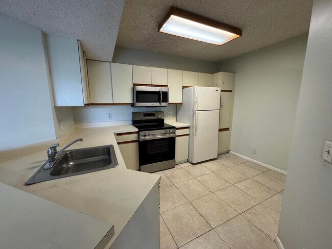 Photo - 8891 Wiles Rd Unidad 303