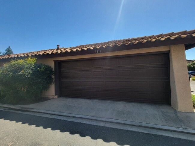 Photo - Condo with open floor plan and a two-car g...