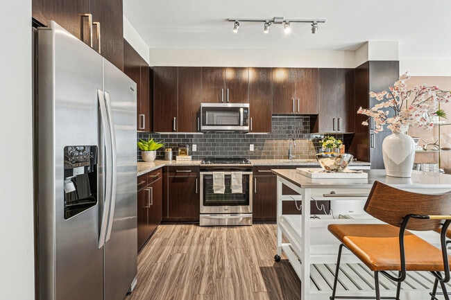 Gather, cook, and entertain in this stylish Goose creek kitchen. - The Heights at Goose Creek Village