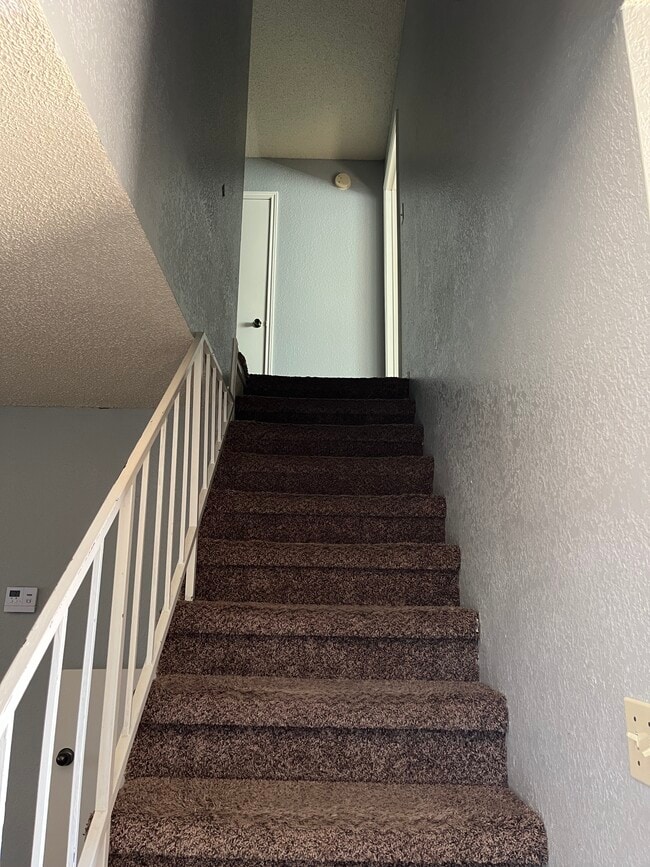 Stairway to second floor - 926 Chisholm Cv Unit 926 Chisholm Cv