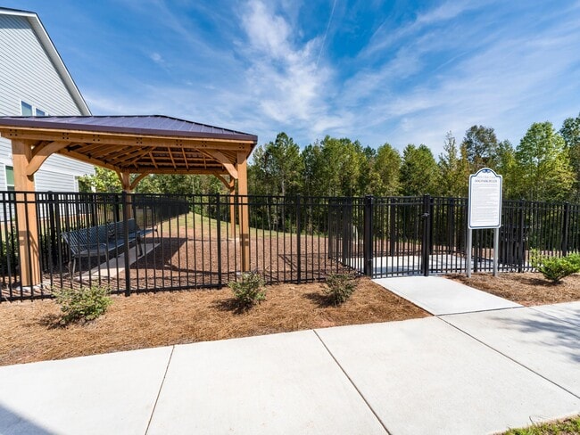 One of two dedicated dog parks at Amavi Brier Creek, offering a convenient place to play and socialize within this thoughtfully planned Durham community.