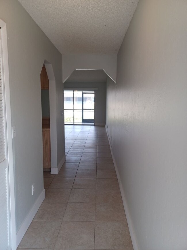Photo - Community Pool / All Tiled Unit with a screened in lanai / Water Included Unit 913 Gleason Pkwy #2