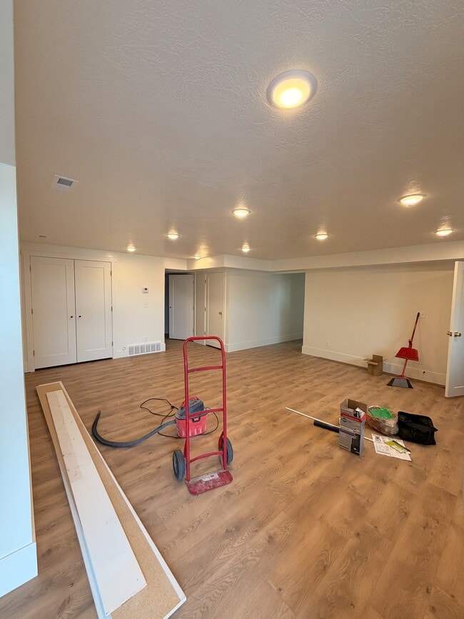View into the living room with kitchen to the right. Luxury laminate flooring throughout unit. - 14 N 300 E