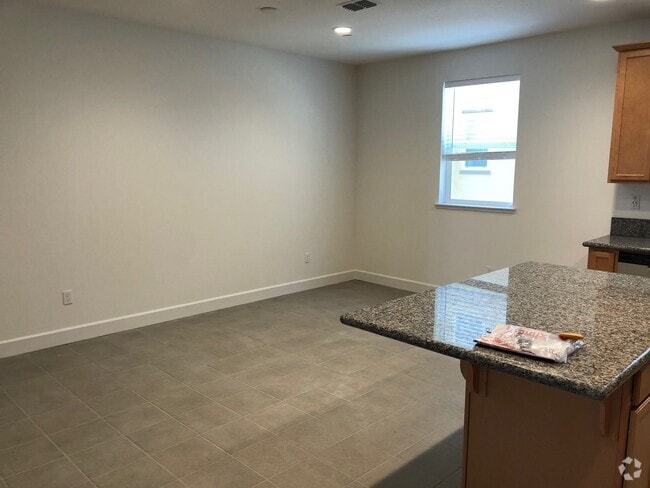 Building Photo - Tri-level Townhome with 2 Car Attached Gar...
