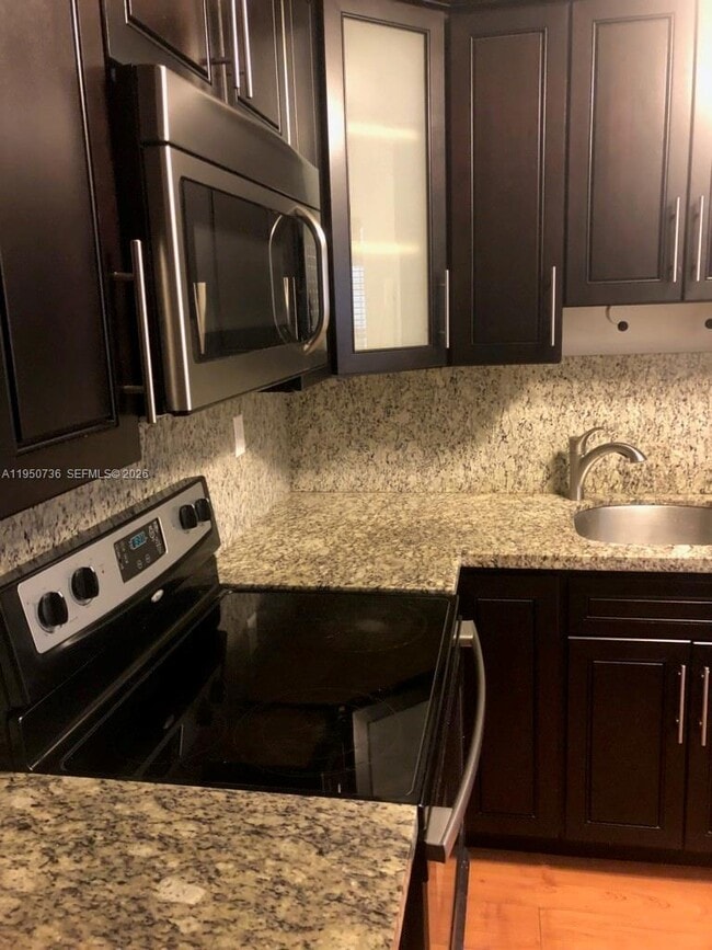 Building Photo - 300 Gardens Dr Unit 104