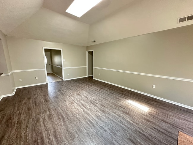 Photo - Charming 3BR/2BA Near Southwind | Soaring Vaulted Ceilings, Rustic Fireplace & Garage