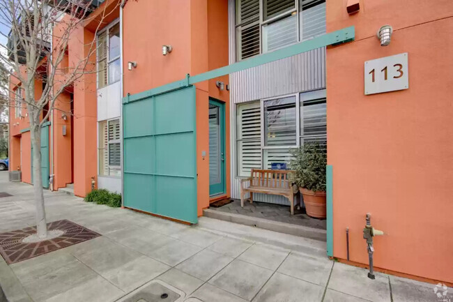 Front entrance with sliding gate. - 113 F St Rental