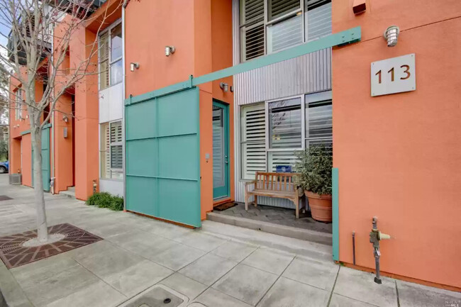 Front entrance with sliding gate. - 113 F St Rental