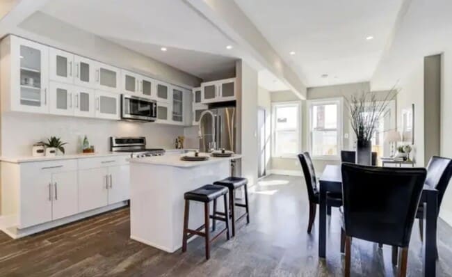 Photo - “Elegant 3-Story Home Showcasing High-End Renovation, Gourmet Kitchen, and Private Deck for Moder...