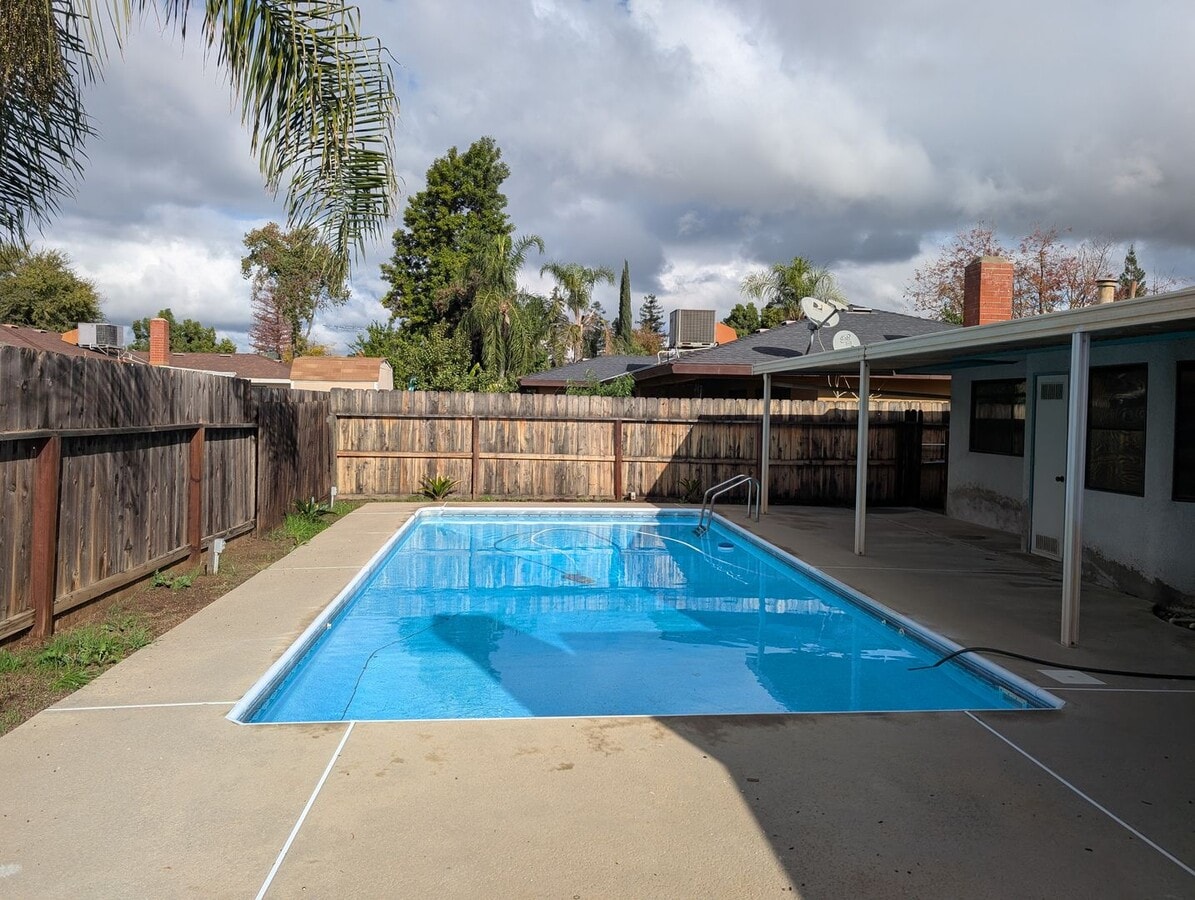 Photo - Nice home home offering nice amenities. Swimming pool + close to shopping and schools.