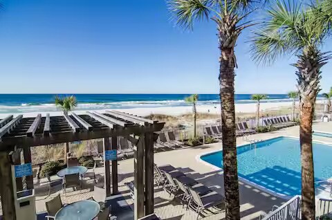 Swim, grill, and relax — the pool and BBQ pavilion make the perfect spot for family fun - 10625 Front Beach Rd Unit 1105