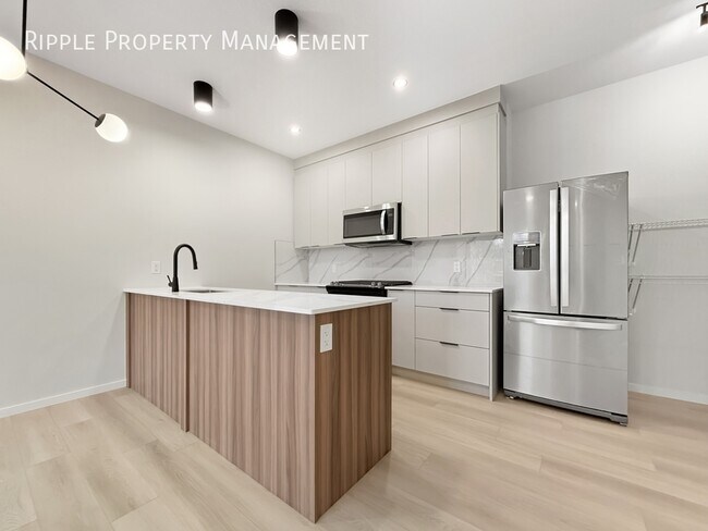 Building Photo - Modern 2 Beds, 2.5 Baths Main Floor/ Upper | No Pets Allowed