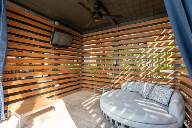 Wooden Cabanas with Ceiling Fans and TVs