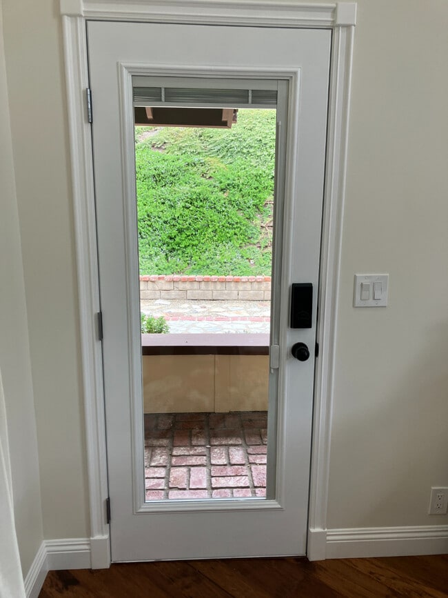 FRONT DOOR OPENS TO PATIO