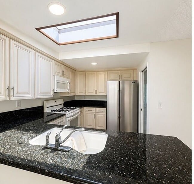 Building Photo - Welcome to this beautifully updated 4-bedroom, 2-bathroom home nestled on a private flag lot in t...