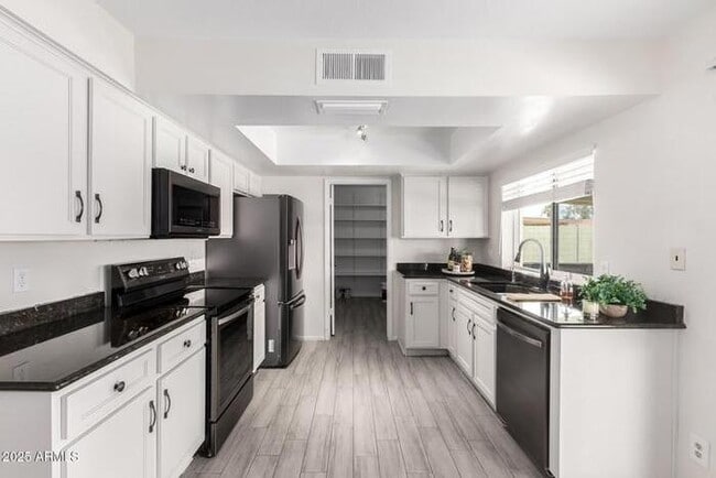 Photo - Beautiful three-bedroom, two-bath with pool and RV parking, available now.