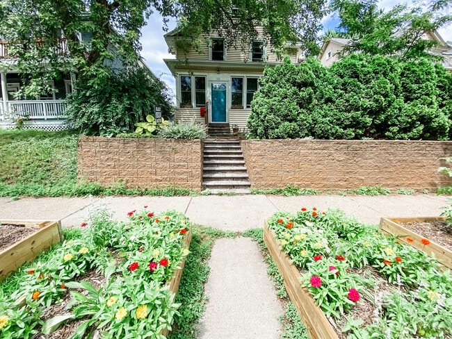 Welcome home! Raised bed gardens and mature trees greet you as you come home! - 819 Edmund Ave