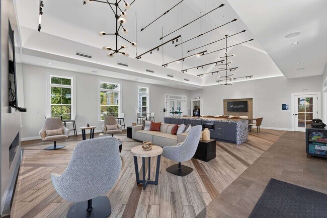 The clubhouse offers flexible seating for gatherings large or small. - The Madison at Marshfield
