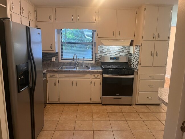 Kitchen with gas cooktop and oven