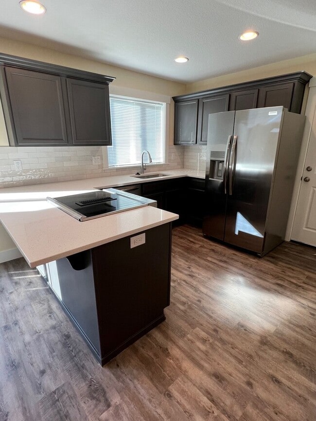 Photo - Remodeled Home with New Flooring, Quart Counters, W/D, Fenced Yard, Parking & MORE!