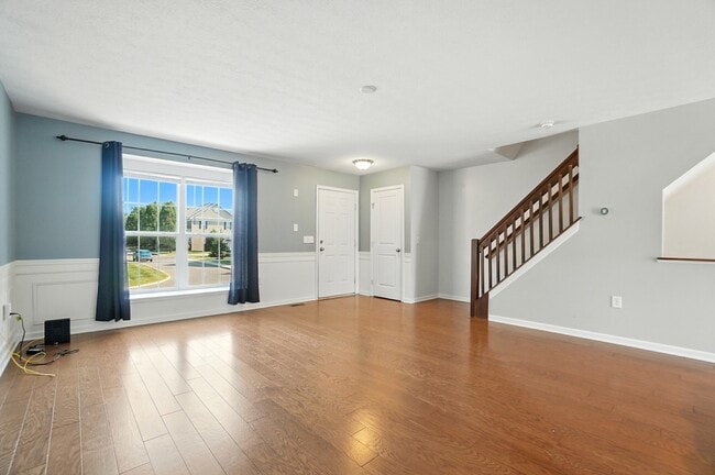 Living room with coat closet - 6169 Needletail Rd Unit 6169 Needletail Rd