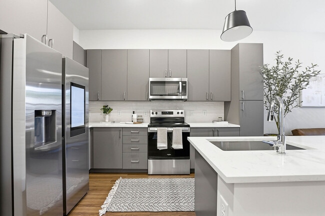 Kitchen with ENERGY STAR® stainless appliances, quartz countertops and smart refrigerator