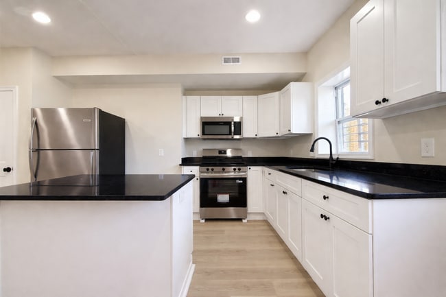 Photo - Modern 3BR Rowhome with Finished Lower Level & Rear Deck