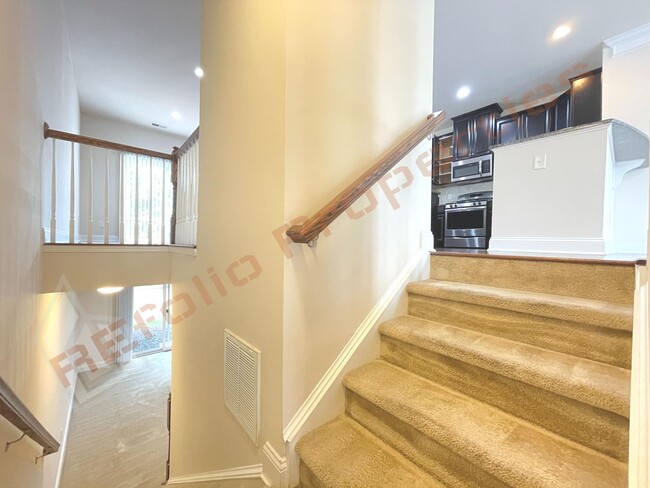 Photo - Beautiful 3 Story 3 Bedroom Townhouse with Huge 1st Floor Flex Space with Access to Patio + 2 Car...