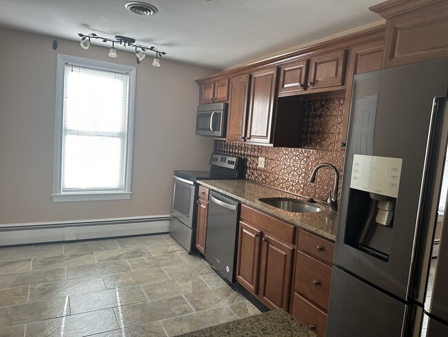 Kitchen with tile floor - 147 Barrett St Apartments Unit #2