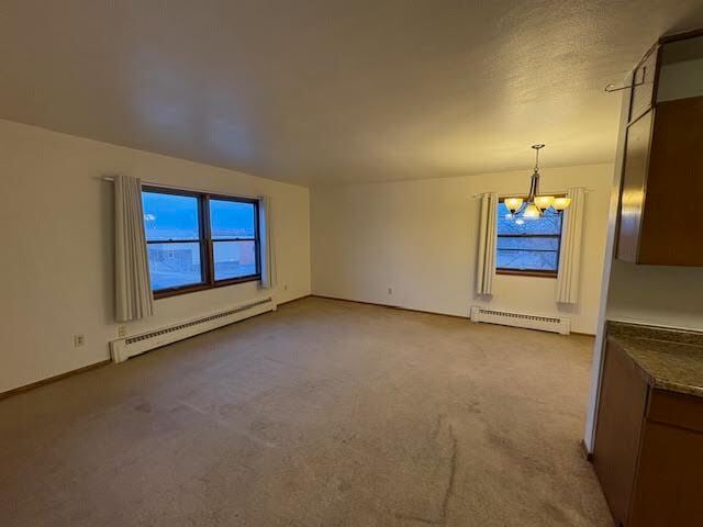 Livingroom with big south and east facing windows - 1022 Arkwright St N Unit 9