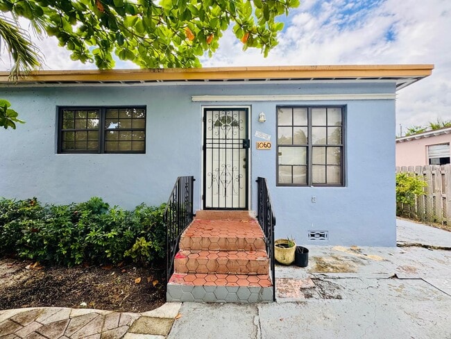 Building Photo - 1060 NW 116th St Unit 1