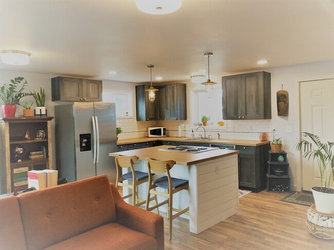 Kitchen area in great room - 910 Pacific Ave N Unit 101-A