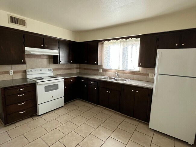 Photo - University Triplex Unit University #A-874
