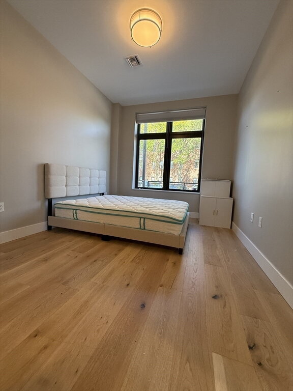 Photo - "Charming 1-Bed Boston Retreat with Granite Touches, Cozy Fireplace & Hardwood Elegance!"