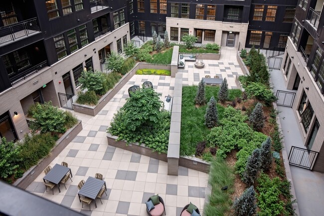 Well-manicured outdoor courtyard with social seating