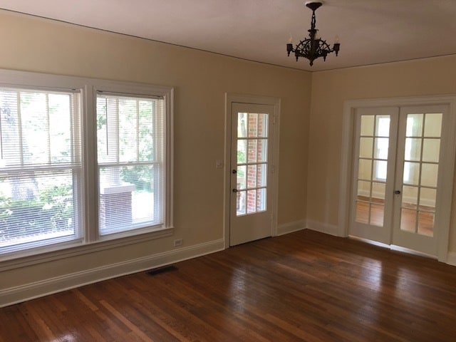 front entry and living room with double doors to dining room - 407 Warren St Unit A